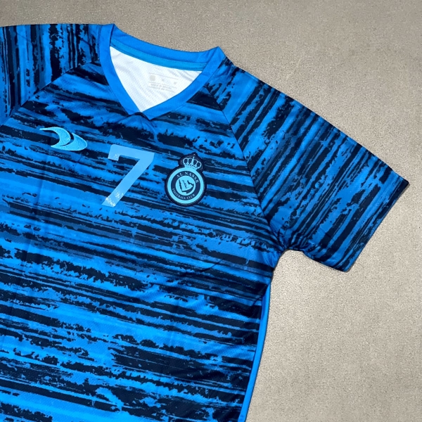 CAMISA DE TRINO AL-NASSR 